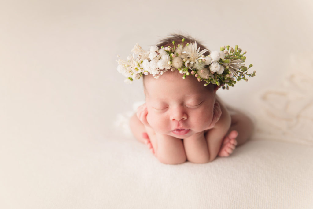posed newborn in a flower crown